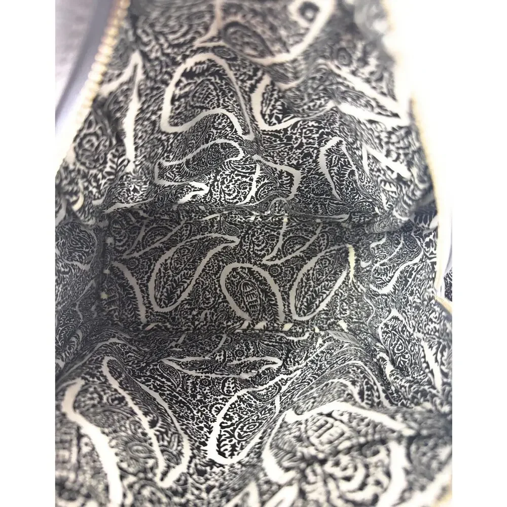 Vera Bradley Black Leather Mini Backpack. Micro Quilt Pockets on the side.